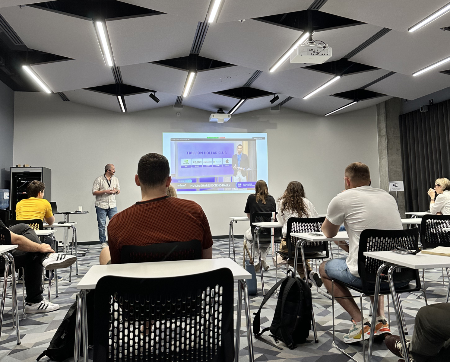 Audience attending presentation in classroom