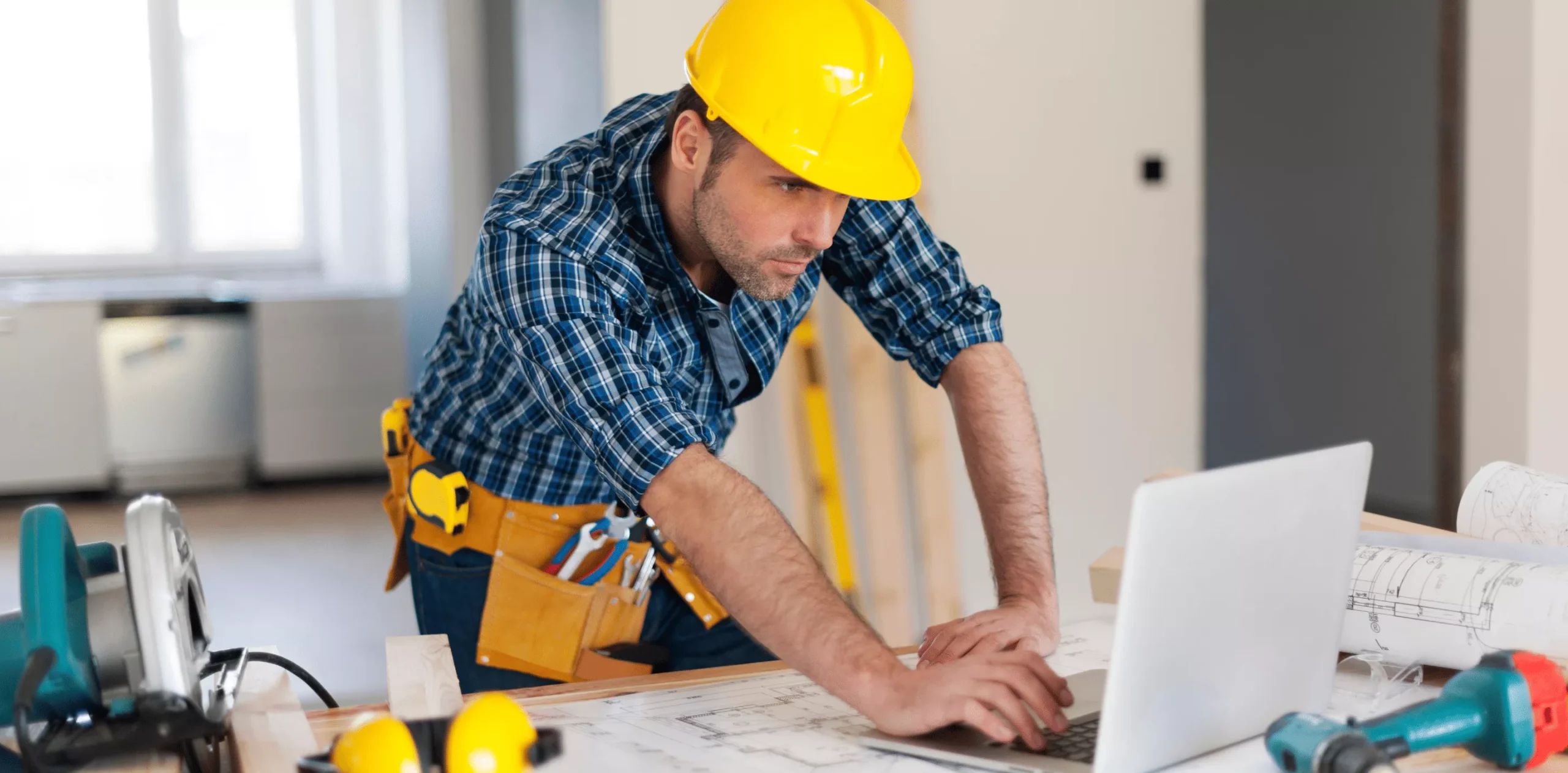 Construction worker using laptop
