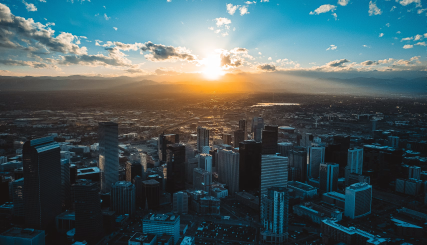Denver skyline with growing neighborhoods and mountain views